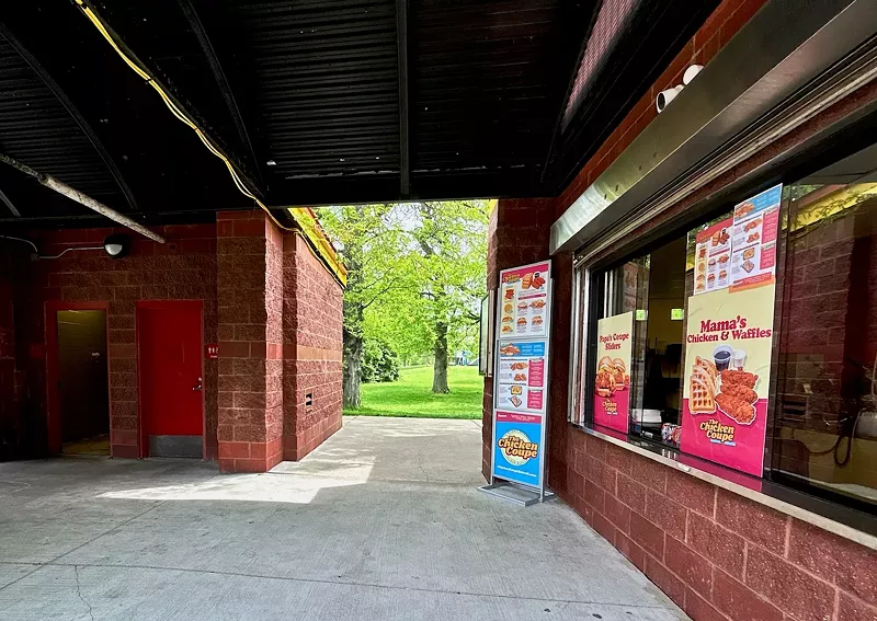 The Chicken Coupe is in a separate building than the bathrooms, although they share the same awning. - Steve Neavling